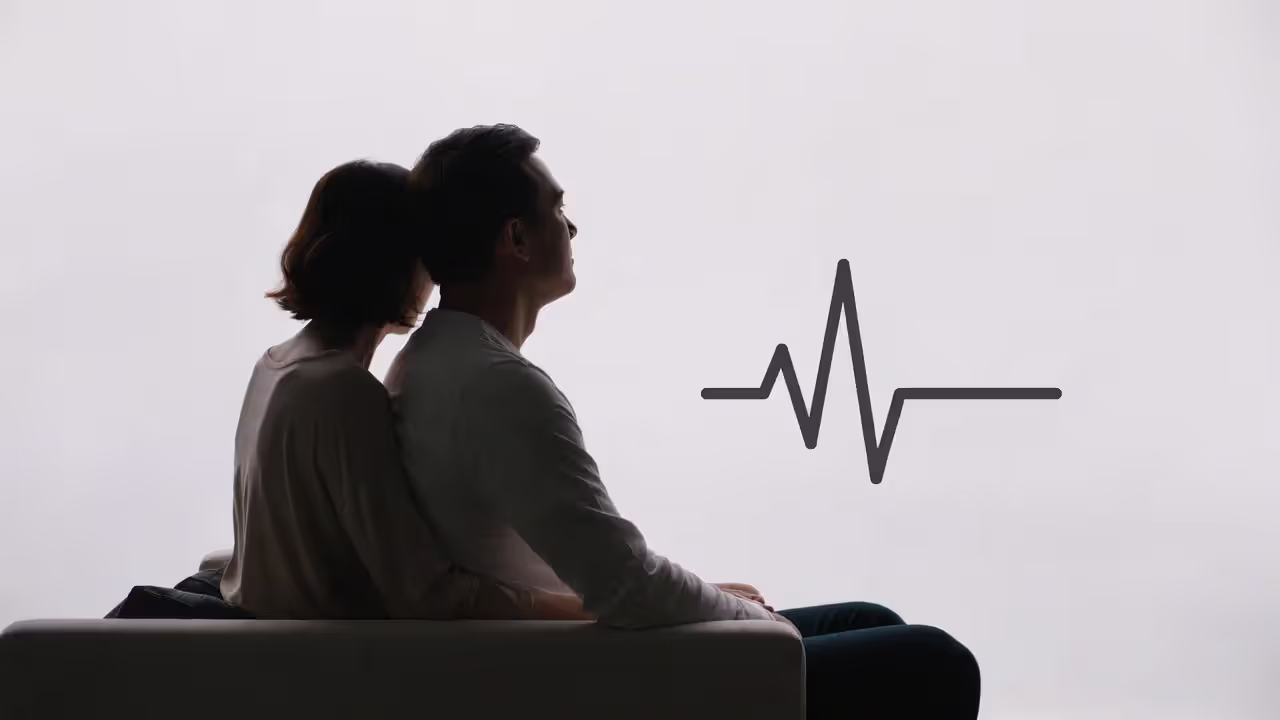 Calm couple sitting together, illustrating comfort with stable healthy love